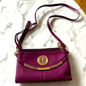 A beautiful purple ladies bag that I never used, it was a gift!